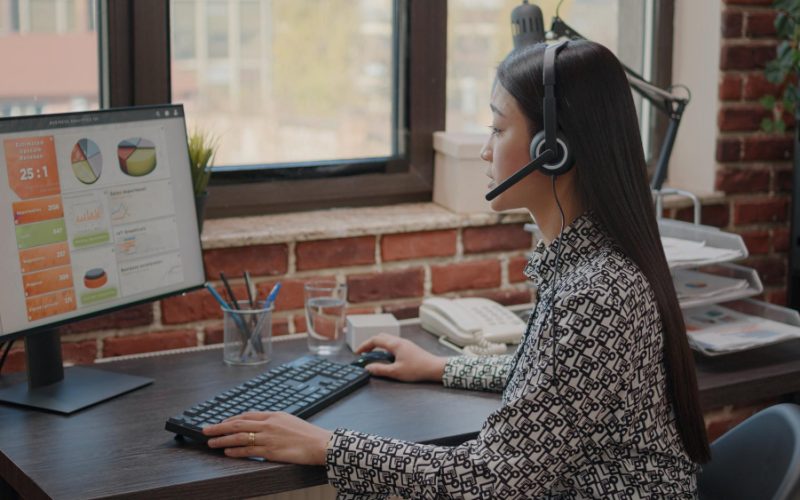 close-up-asian-woman-with-headphones-talking-phone-call-people-customer-service-consultant-using-headset-microphone-working-call-center-computer-support-chat